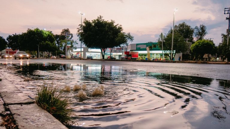 Water pooling on a road after heavy rain